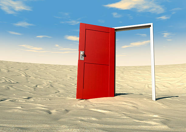 istock Red Door Open In A Desert 160384003