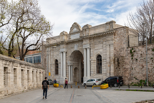 Istanbul, Turkey - April 14, 2023: A picture of a large gateway leading up to the Suleymaniye Mosque.
