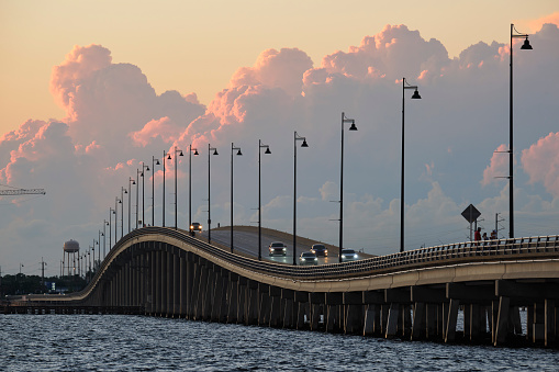Barron Collier Bridge and Gilchrist Bridge in Florida with moving traffic. Transportation infrastructure in Charlotte County connecting Punta Gorda and Port Charlotte over Peace River.