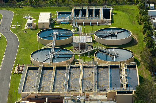 Aerial view of water treatment factory at city wastewater cleaning facility. Purification process of removing undesirable chemicals, suspended solids and gases from contaminated liquid.
