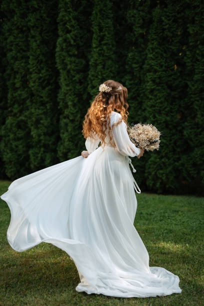 istock red-haired girl bride with a wedding bouquet 1603876747
