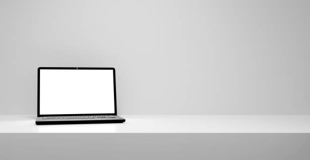 istock Laptop with empty blank white screen mock up for advertisment and design, empty gray table stage podium with laptop concept, gray and white background 1603949484