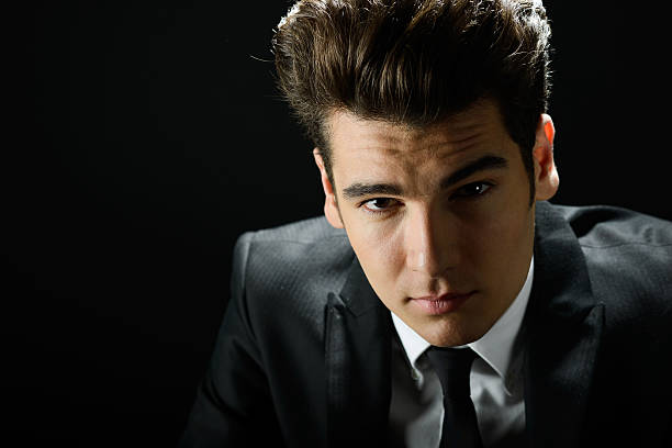 istock Young businessman, isolated on black background 160400897