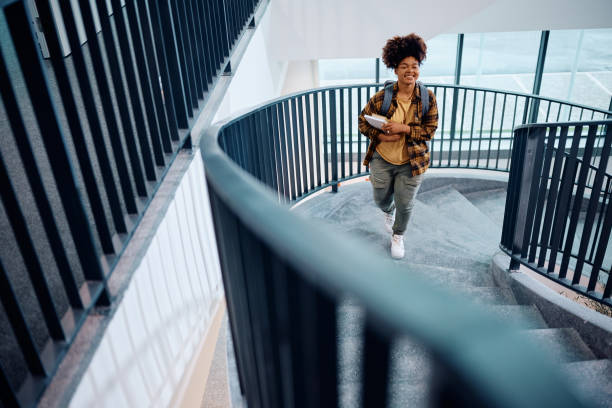 Black female student going to a lecture at the university.