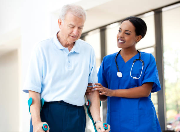 istock Nurse helping a senior patient in crutches 160409809
