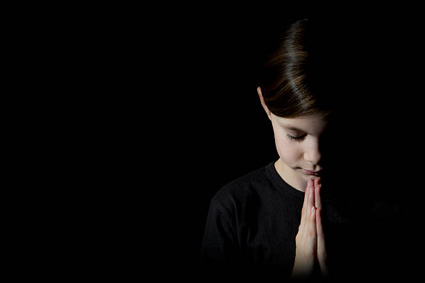 istock Pretty Girl Praying 160412492