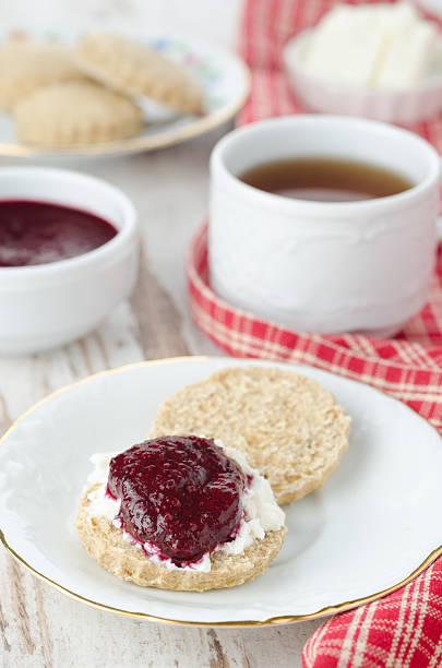 istock Scone with goat cheese and jam for breakfast closeup 160412519