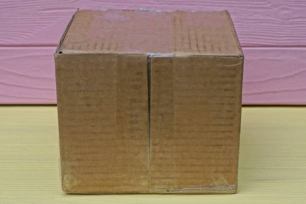 istock one brown paper closed square parcel cardboard box 1604133050