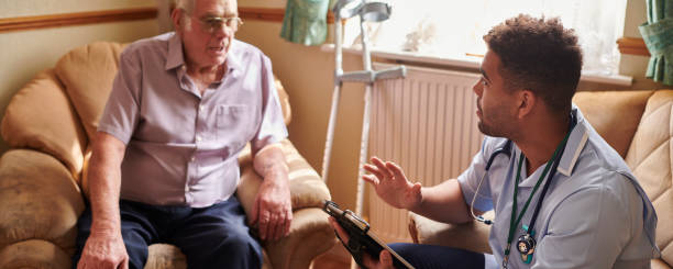 istock male nurse visiting patient at home 1604133767