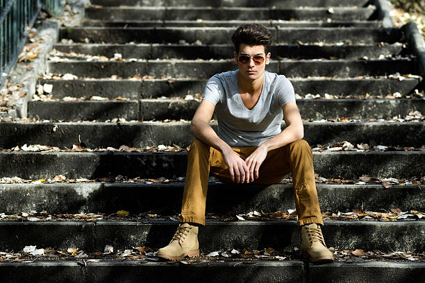 istock Young handsome man with modern hairstyle in stairs 160416174