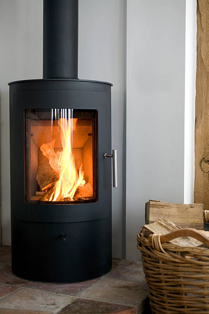 Wood Burning Stove Modern Wood burning stove in modern interior wood burning stove stock pictures, royalty-free photos & images