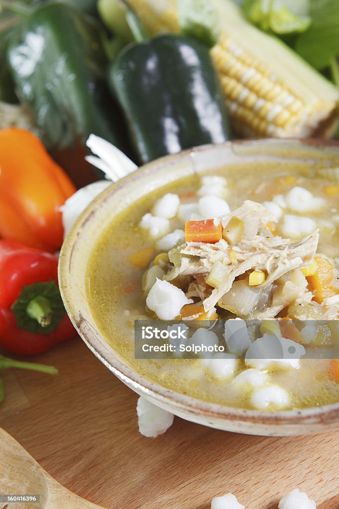 Bowl of chicken posole. Hearty bowl of chicken posole, the traditional food of Mexico and Latin America. Chicken Meat Stock Photo