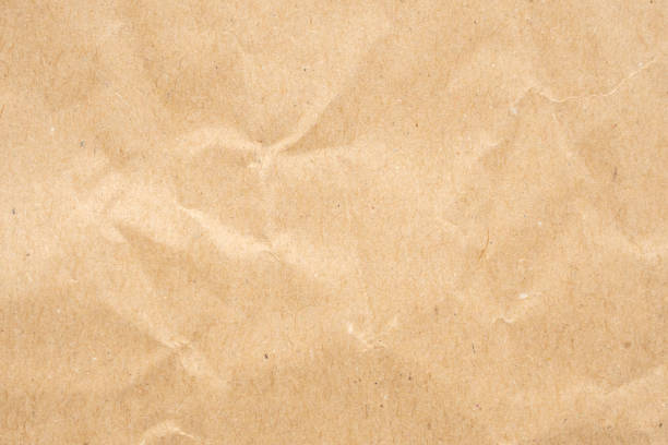 istock Abstract crumpled and creased recycle brown paper texture background 1604171624