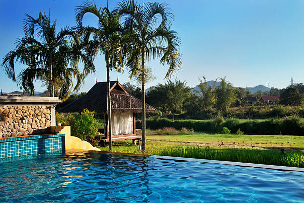 Tropical resort. Poolside with beautiful mountain view in Thailand.
