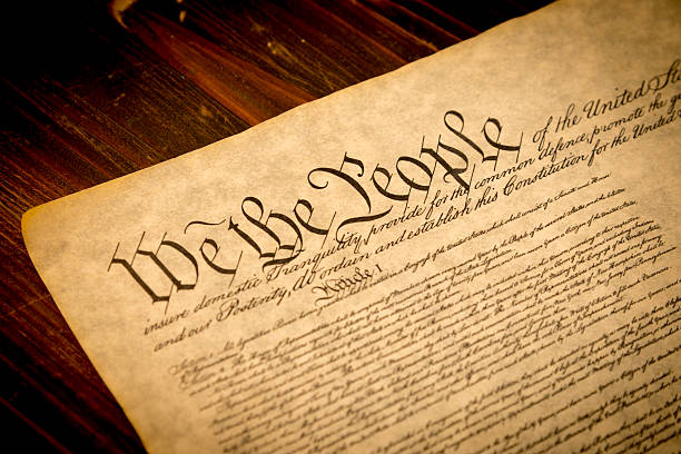 istock Upper portion of U.S. Constitution on wooden desk 160418204