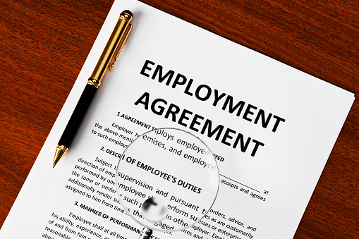 Employment agreement document on desk