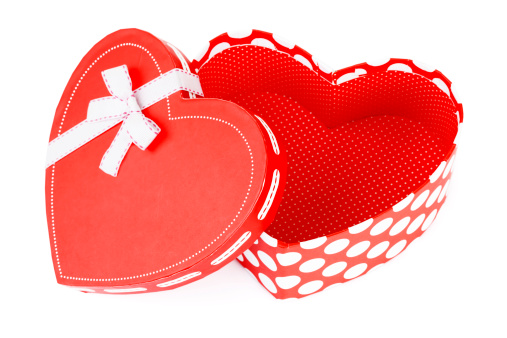 white heart shaped box for valentine's day or christmas on red background