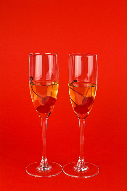 два valentine шампанское очки с на красной вишни - cherry valentine стоковые фото и изображения