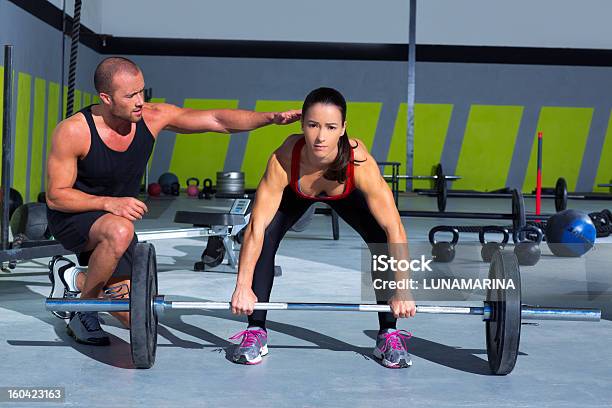 Personal Trainer With Woman Performing Deadlift Stock Photo - Download Image Now - 20-29 Years, Active Lifestyle, Activity