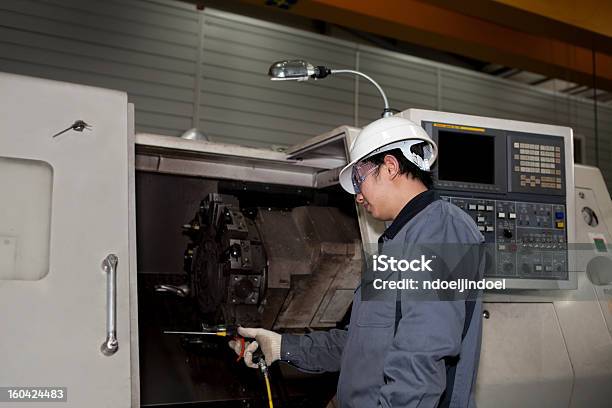 Mechanical Technician Of Cnc Machine Stock Photo - Download Image Now - Machinery, CNC Machine, Order