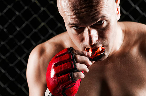 Close-up photograph of the fighter Mixed Martial Arts Fighter mouthguard stock pictures, royalty-free photos & images