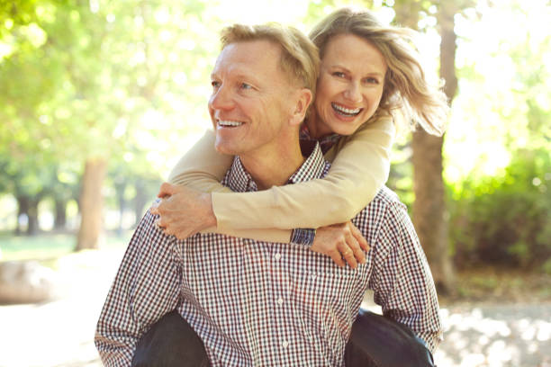 istock Man carrying his wife on piggy back 160426472