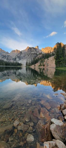 istock Tranquil Reflection: Majestic Mountain Landscape with Serene Lake and Sky 1604287050