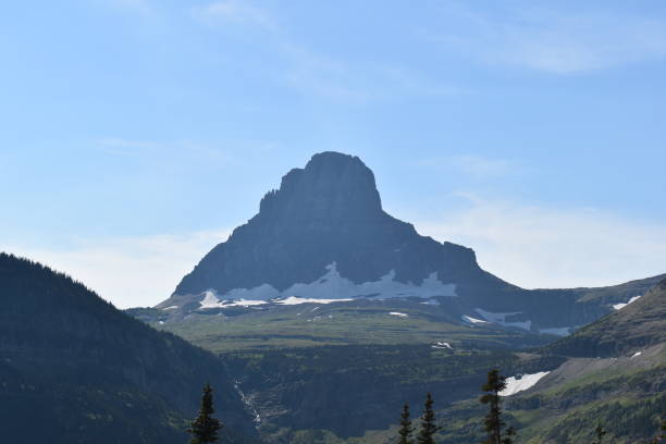 istock Vast Mountain Range and Panoramic Landscape Under a Sky of Fluffy White Clouds 1604288141