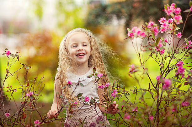 istock Laughing girl and pink flowers 160429129