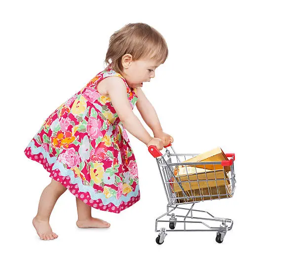 Photo of Little girl pushing a trolley
