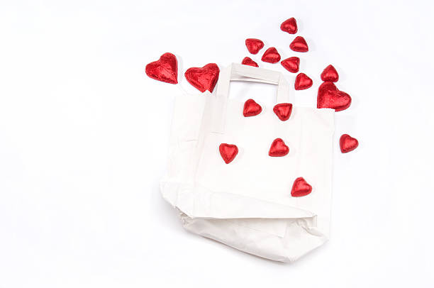istock Red hearts resting on white paper bag 160429565