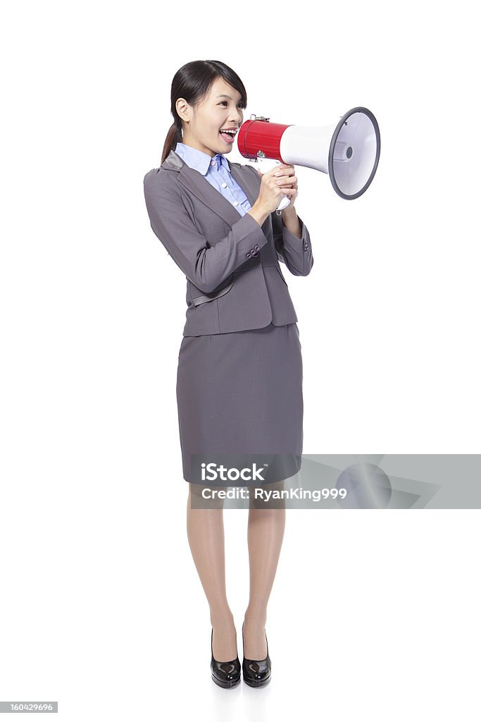 Business woman with megaphone yelling Business woman with megaphone yelling and screaming isolated on white background, asian White Background Stock Photo