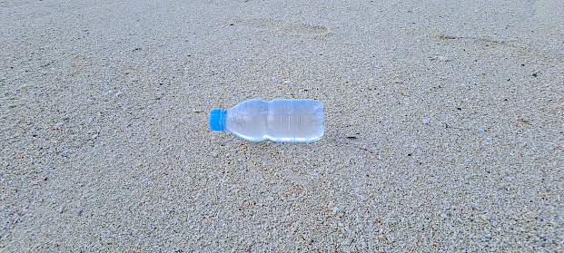Plastic drink bottle washed up at beach