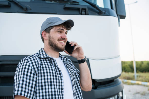 istock Truck driver calling his family. 1604329549