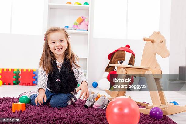 Little Girl Playing In The Room Stock Photo - Download Image Now - Activity, Beautiful People, Beauty