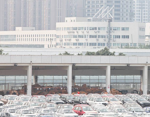 Cars are driving around the car park.
