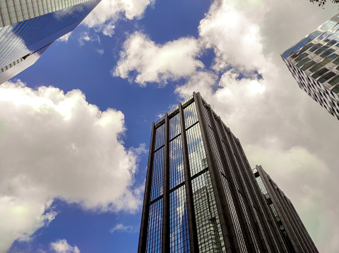 Hong Kong, August 06,2023 : Low angle view of buildings in Hong Kong city against sky