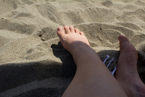 Relaxing on a tropical beach with turquoise water and coconut trees. Caribbean Sea.