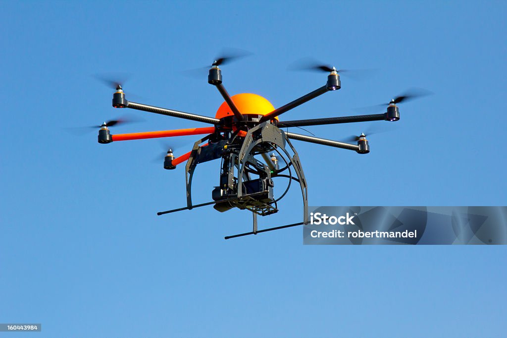 Octocopter Drone Rotation Robotic Octocopter Drone Hovering In A Clear Blue Sky Stock Photo ...