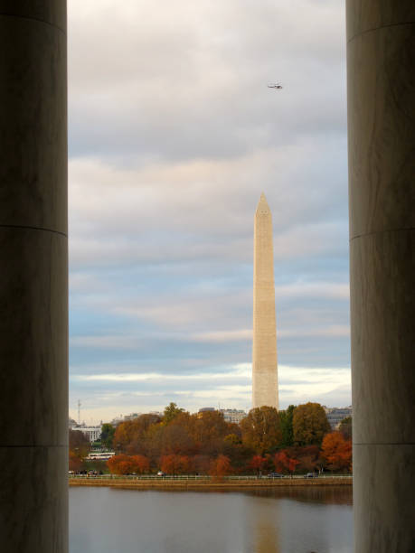 istock Washington Monument from Jefferson Memorial across Tidal Basin with Helicopter 1604450143