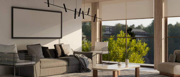 istock Contemporary, spacious living room interior with a comfy grey couch, a coffee table 1604464672