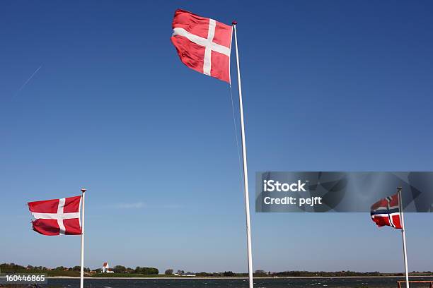 Flags Of Denmark And Norway In Limfjorden Stock Photo - Download Image Now - Denmark, Fjord, Flag