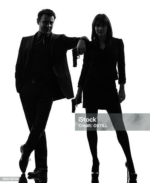 Photo libre de droit de Couple Homme Femme Détective Agent Secret Silhouette Criminelle banque d'images et plus d'images libres de droit de Femmes