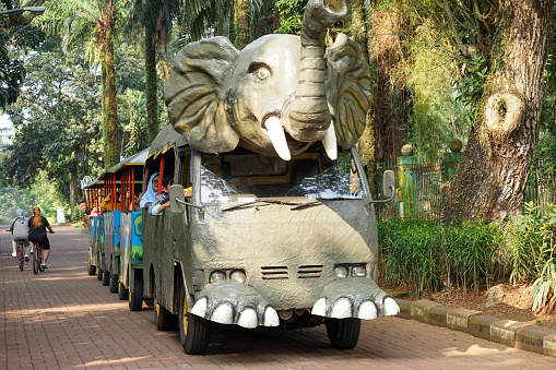 Jakarta, Indonesia - on the 30th of June 2023. Odong odong mini tourist train car in the shape of an elephant's head