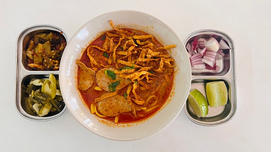 Curried Noodle Soup (Khao soi) with coconut milk, Northern Thai cuisine.