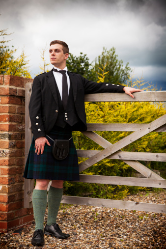 A Scotsman in kilt outdoors.