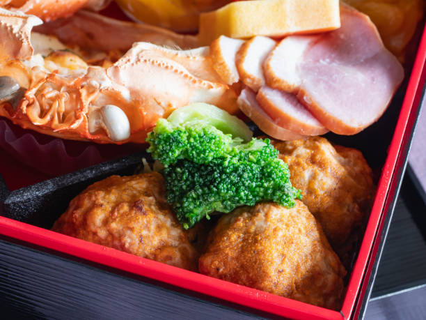 istock Japanese osechi dish. Meatballs and broccoli. 1604591034