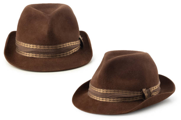 Woman with a hat with her head down on the table symbolizing tiredness and sadness