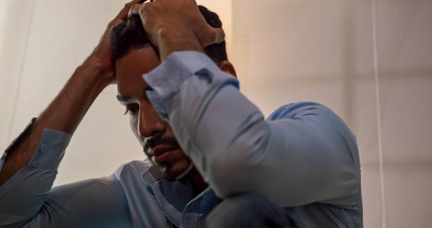 istock A businessman sitting on the floor depressed and stressed with problems in his life. 1604636831