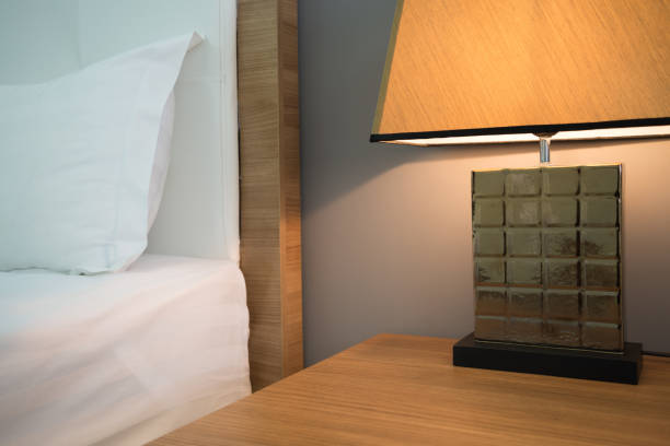 istock Beautiful table lamp bedside in bedroom. 1604644774
